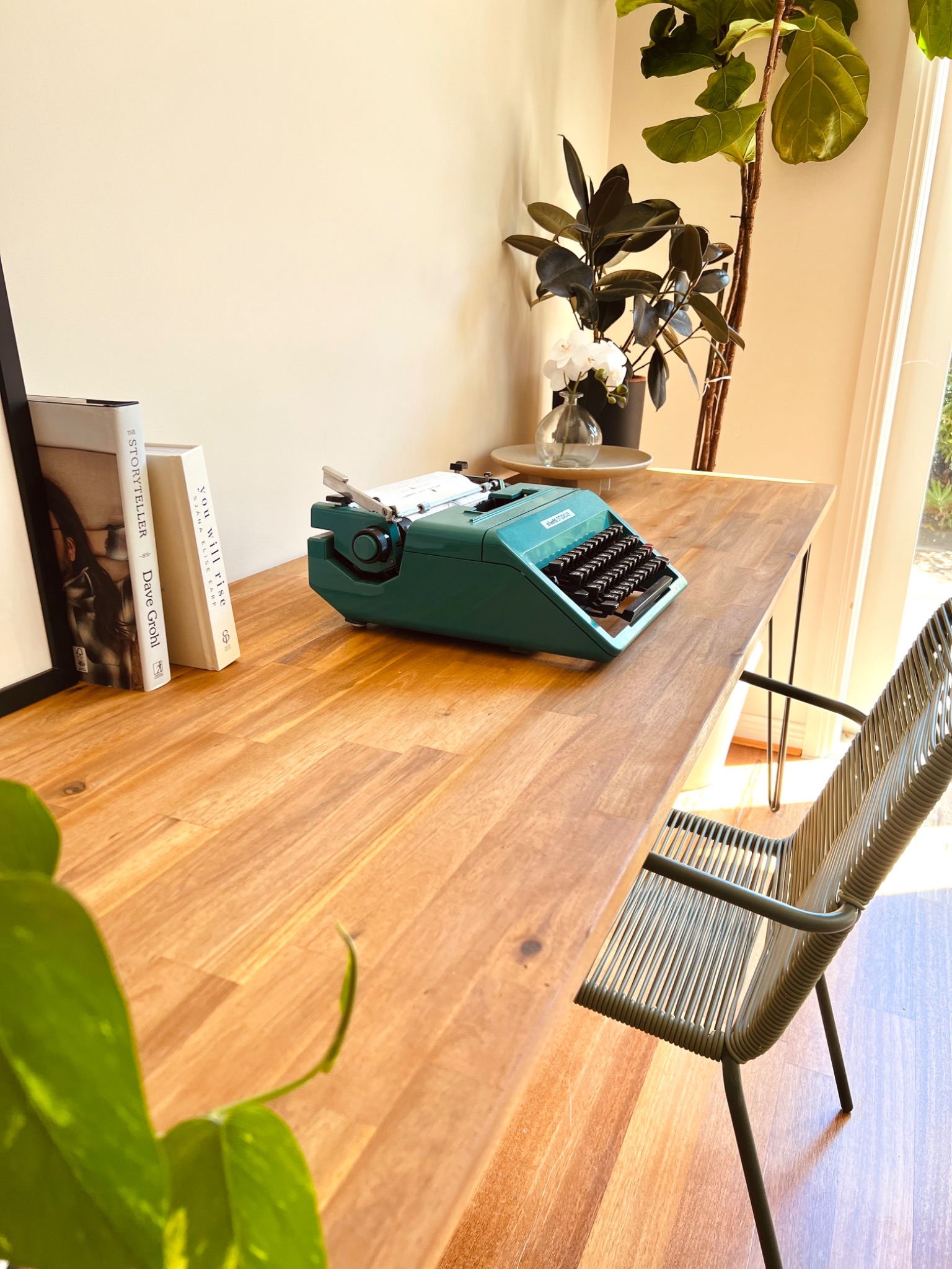 Vintage-style industrial table side view with plants and natural light